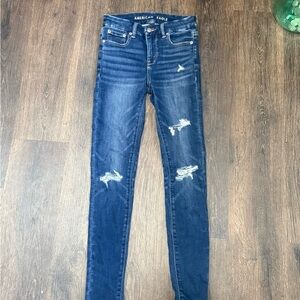 AE Women’s Dark Blue Distressed Jeggings